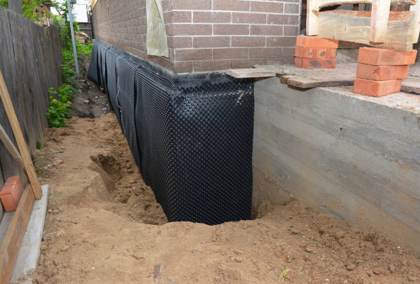 Happy homeowners after waterproofing job in Vesper